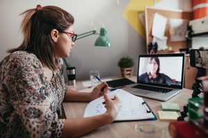 Woman speaking to man online group membership program