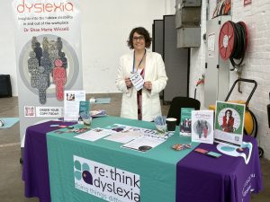 Shae at the re:think dyslexia stand at the Australian Neurodevelopmental Disorders Conference